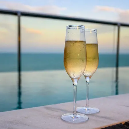 Vogal Luxury Beach Hotel & Spa Natal Exterior photo Two champagne flutes